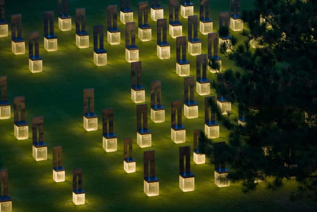 Oklahoma City Bombing Memorial; Field of empty chairs. One lit chair is present for each of the 168 people lost; each is inscribed with a name.